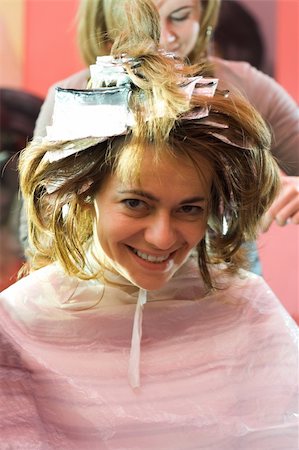 foil highlights - Happy woman sitting at the hair stylist, her hair is being bleached Stock Photo - Budget Royalty-Free & Subscription, Code: 400-04500437