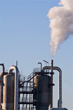 Industrial plant exhausting smokes into the atmosphere. Stock Photo - Budget Royalty-Free & Subscription, Code: 400-04500544