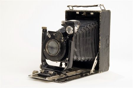 The old photographic chamber with a lens of furs on a white background. Stockbilder - Microstock & Abonnement, Bildnummer: 400-04500955