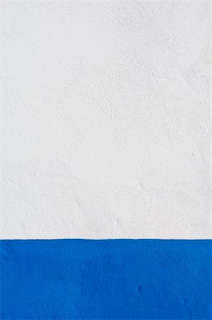 Detail of white wall with a nice deep blue baseboard Foto de stock - Super Valor sin royalties y Suscripción, Código: 400-04501352