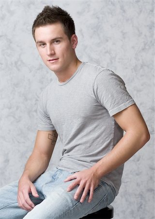 simsearch:400-03995127,k - cute male model in a casual pose Stock Photo - Budget Royalty-Free & Subscription, Code: 400-04501425