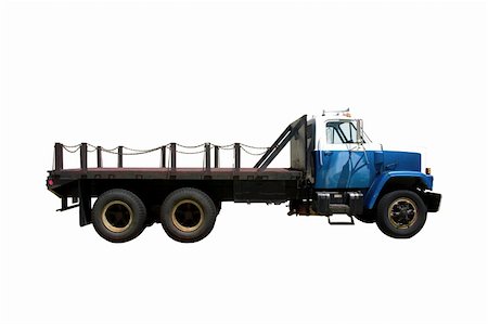 This is the side view of a flat bed stright truck with a city style day cab. isolated on white. Stock Photo - Budget Royalty-Free & Subscription, Code: 400-04501584