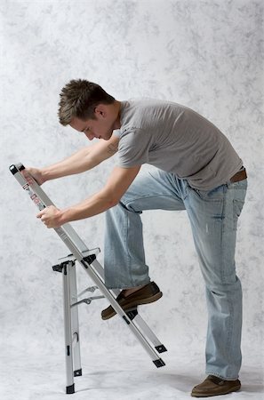 Man, casually dressed, with a ladder Foto de stock - Royalty-Free Super Valor e Assinatura, Número: 400-04501634