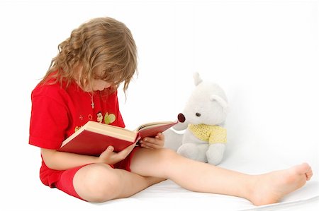 little girl reading a book with teddy-bear, white background Stock Photo - Budget Royalty-Free & Subscription, Code: 400-04501710