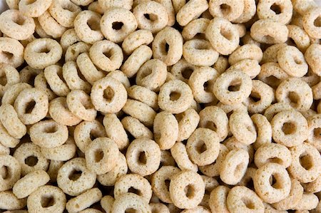 Toasted oats breakfast cereal up close, for a background image. Stockbilder - Microstock & Abonnement, Bildnummer: 400-04501760