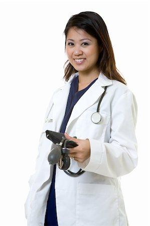 simsearch:400-03995908,k - Female attractive Asian doctor wearing white lab coat wearing a stethoscope around shoulders and holding a blood pressure cuff smiling standing on white background Stock Photo - Budget Royalty-Free & Subscription, Code: 400-04501782