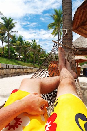 pictures of men sleeping in hammocks - Man in hammock on the beach Stock Photo - Budget Royalty-Free & Subscription, Code: 400-04502028