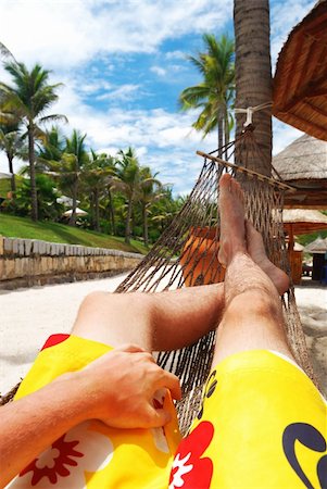 sleeping man foot - Man in hammock on the beach Photographie de stock - Aubaine LD & Abonnement, Code: 400-04502028