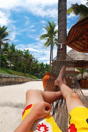 sleeping man foot - Man in hammock on the beach Photographie de stock - Aubaine LD & Abonnement, Code: 400-04502029