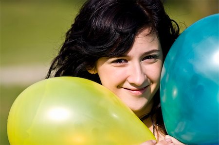 simsearch:400-03996855,k - Cute girl between two colored balloons Stock Photo - Budget Royalty-Free & Subscription, Code: 400-04502556