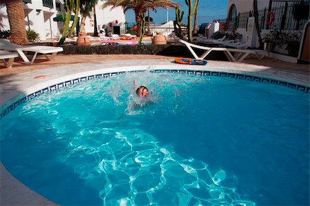 girl having fun in the pool Stock Photo - Budget Royalty-Free & Subscription, Code: 400-04502566