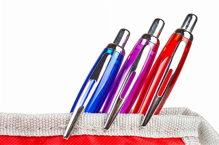 simsearch:400-09186322,k - Three pens in a red pencil case over a white background Photographie de stock - Aubaine LD & Abonnement, Code: 400-04502765