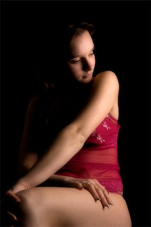 simsearch:400-05041629,k - Studio portrait of a woman in luxurious lingerie in a low key setting Fotografie stock - Microstock e Abbonamento, Codice: 400-04503037