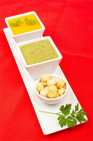 simsearch:400-07092695,k - Spinach and carrots puree, bread croutons with parsley on red mat. Shallow DOF Fotografie stock - Microstock e Abbonamento, Codice: 400-04503198