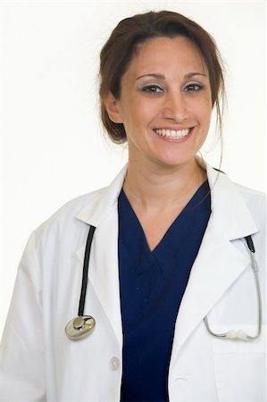 simsearch:400-05172792,k - Brunette lady doctor wearing white lab coat with a stethoscope around shoulders smiling standing on white background Foto de stock - Royalty-Free Super Valor e Assinatura, Número: 400-04503264