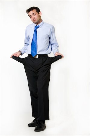 simsearch:400-06634114,k - Full body of a handsome brunette young business man standing on white holding out empty pant pockets Fotografie stock - Microstock e Abbonamento, Codice: 400-04503278