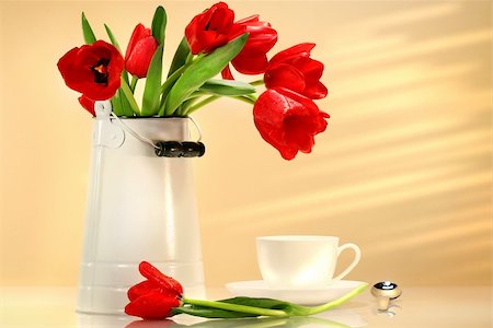 simsearch:649-09205900,k - Red tulips in white container with tea cup Stock Photo - Budget Royalty-Free & Subscription, Code: 400-04503613