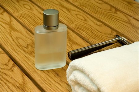 men's perfume in a bathroom with towel and shaver Stock Photo - Budget Royalty-Free & Subscription, Code: 400-04514045