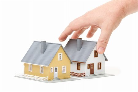 simsearch:628-05818023,k - Male hand reaching for house isolated on a white background. Foto de stock - Super Valor sin royalties y Suscripción, Código: 400-04515324