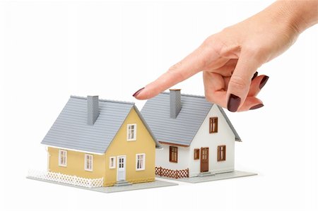 simsearch:628-05818023,k - Female hand pointing at a house isolated on a white background. Foto de stock - Super Valor sin royalties y Suscripción, Código: 400-04515325