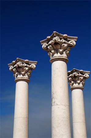 stone base - Three ancient greek pillars against a blue sky Stock Photo - Budget Royalty-Free & Subscription, Code: 400-04515600