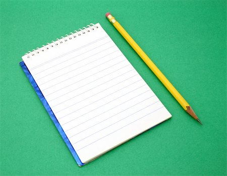 simsearch:400-03990507,k - yellow pen besides an open notebook on a green surface Stock Photo - Budget Royalty-Free & Subscription, Code: 400-04515900