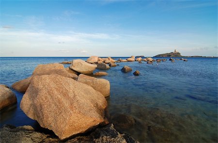 simsearch:400-04900592,k - Sardinia sea with lighthouse and stone pier Photographie de stock - Aubaine LD & Abonnement, Code: 400-04515954