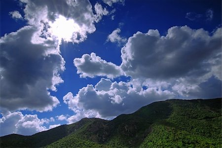 simsearch:400-04872162,k - Sun is shining through the clouds in the mountains Stock Photo - Budget Royalty-Free & Subscription, Code: 400-04515957