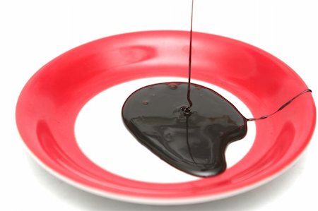 Drops of chocolate on the spoon and a plate Stockbilder - Microstock & Abonnement, Bildnummer: 400-04516001