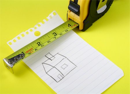 simsearch:400-07246719,k - a measuring tape over a drawing of a house on a notepad Stockbilder - Microstock & Abonnement, Bildnummer: 400-04516146