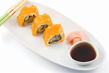 simsearch:689-03123940,k - sushi rolls served on a plate with soy sauce, shot on white Photographie de stock - Aubaine LD & Abonnement, Code: 400-04516548