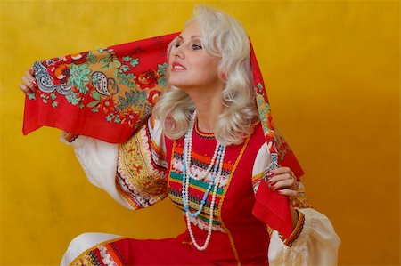 simsearch:400-05051542,k - a beautifull woman in a folk russian dress on yellow background Stock Photo - Budget Royalty-Free & Subscription, Code: 400-04518180