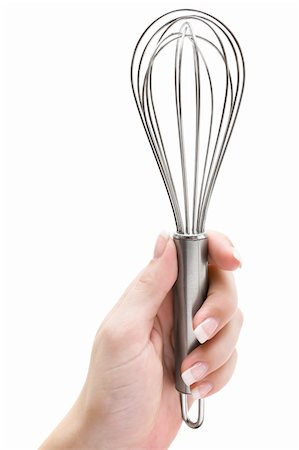 simsearch:400-05231767,k - Woman holding a wire whisk. Isolated on a white background. Photographie de stock - Aubaine LD & Abonnement, Code: 400-04518572
