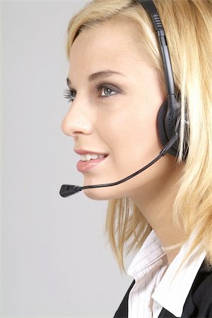 simsearch:400-03990860,k - a friendly woman with blond hair and headphone Photographie de stock - Aubaine LD & Abonnement, Code: 400-04518610