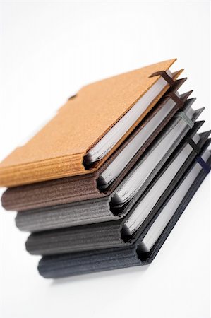 simsearch:400-03990507,k - Stack of notebooks  with color cover over white Stock Photo - Budget Royalty-Free & Subscription, Code: 400-04518788