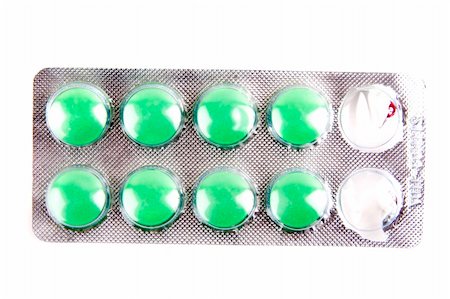 slicky (artist) - green pills isolated on the white background Foto de stock - Royalty-Free Super Valor e Assinatura, Número: 400-04518915
