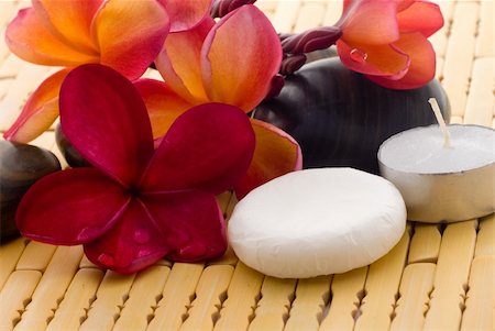 Aromatherapy and spa massage on tropical bamboo and polished stones. Stockbilder - Microstock & Abonnement, Bildnummer: 400-04519017