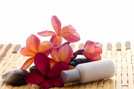 Aromatherapy and spa massage on tropical bamboo and polished stones. Stockbilder - Microstock & Abonnement, Bildnummer: 400-04519018