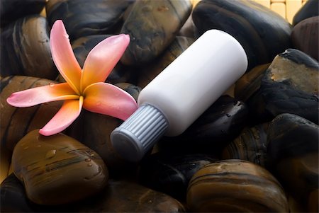 Aromatherapy and spa massage on tropical bamboo and polished stones. Stockbilder - Microstock & Abonnement, Bildnummer: 400-04519027