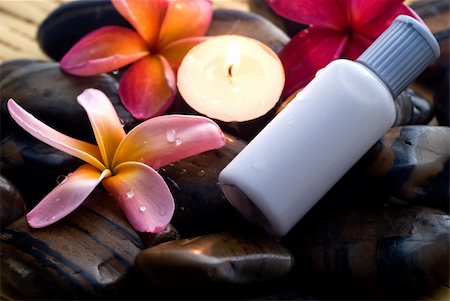 Aromatherapy and spa massage on tropical bamboo and polished stones. Stockbilder - Microstock & Abonnement, Bildnummer: 400-04519028