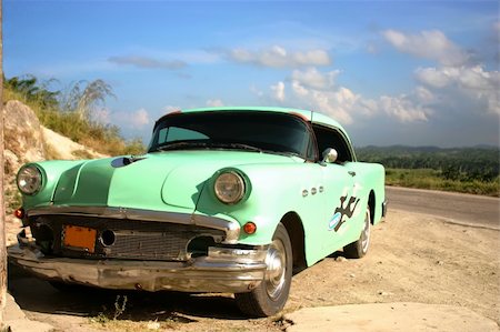 retro car green - Old car near road over blue sky with clouds Stock Photo - Budget Royalty-Free & Subscription, Code: 400-04519107