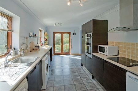 simsearch:400-08315056,k - A new kitchen in a newly converted house Fotografie stock - Microstock e Abbonamento, Codice: 400-04519101