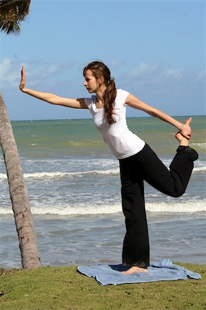 Balancing and yoga exercises on the beach Stock Photo - Budget Royalty-Free & Subscription, Code: 400-04519411