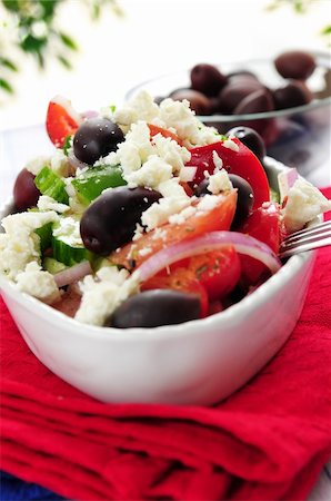 person eating greek salad - Greek salad with feta cheese and black kalamata olives Stock Photo - Budget Royalty-Free & Subscription, Code: 400-04519786