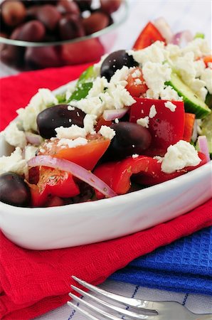 person eating greek salad - Greek salad with feta cheese and black kalamata olives Stock Photo - Budget Royalty-Free & Subscription, Code: 400-04519783