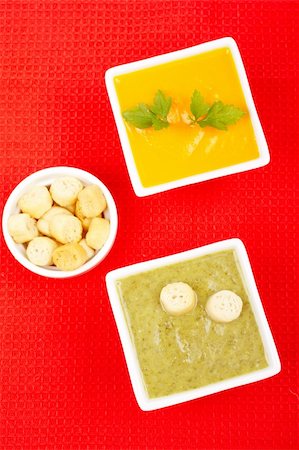 simsearch:400-07092695,k - Spinach and carrots puree with parsley, bread croutons on red mat. Shallow DOF Fotografie stock - Microstock e Abbonamento, Codice: 400-04510048