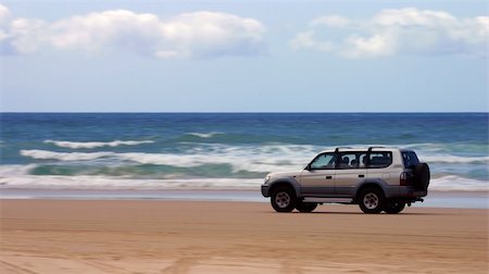 Four-wheel-drive SUV moving on a beach (Fraser Island, Australia) Stock Photo - Budget Royalty-Free & Subscription, Code: 400-04510266