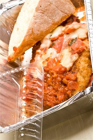 carry out meal chicken parmesan with a slice of bread in the carry out container Photographie de stock - Aubaine LD & Abonnement, Code: 400-04510317