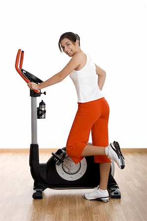 Beautiful young woman on the gym after making exercise Stock Photo - Budget Royalty-Free & Subscription, Code: 400-04510366