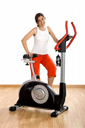 Beautiful young woman on the gym after making exercise Stock Photo - Budget Royalty-Free & Subscription, Code: 400-04510371